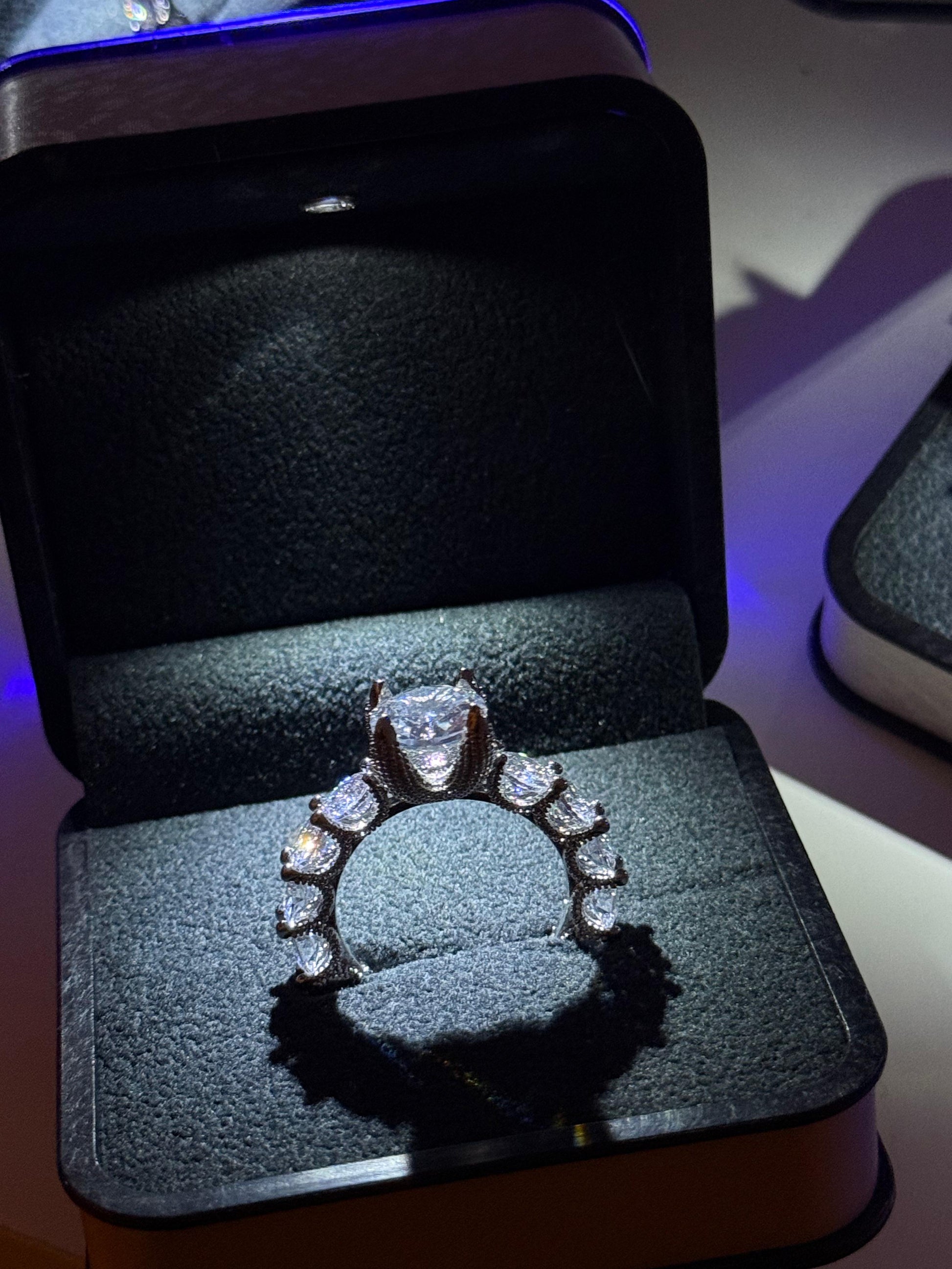 Deluxe ring in a jewelry box with a blue light source.